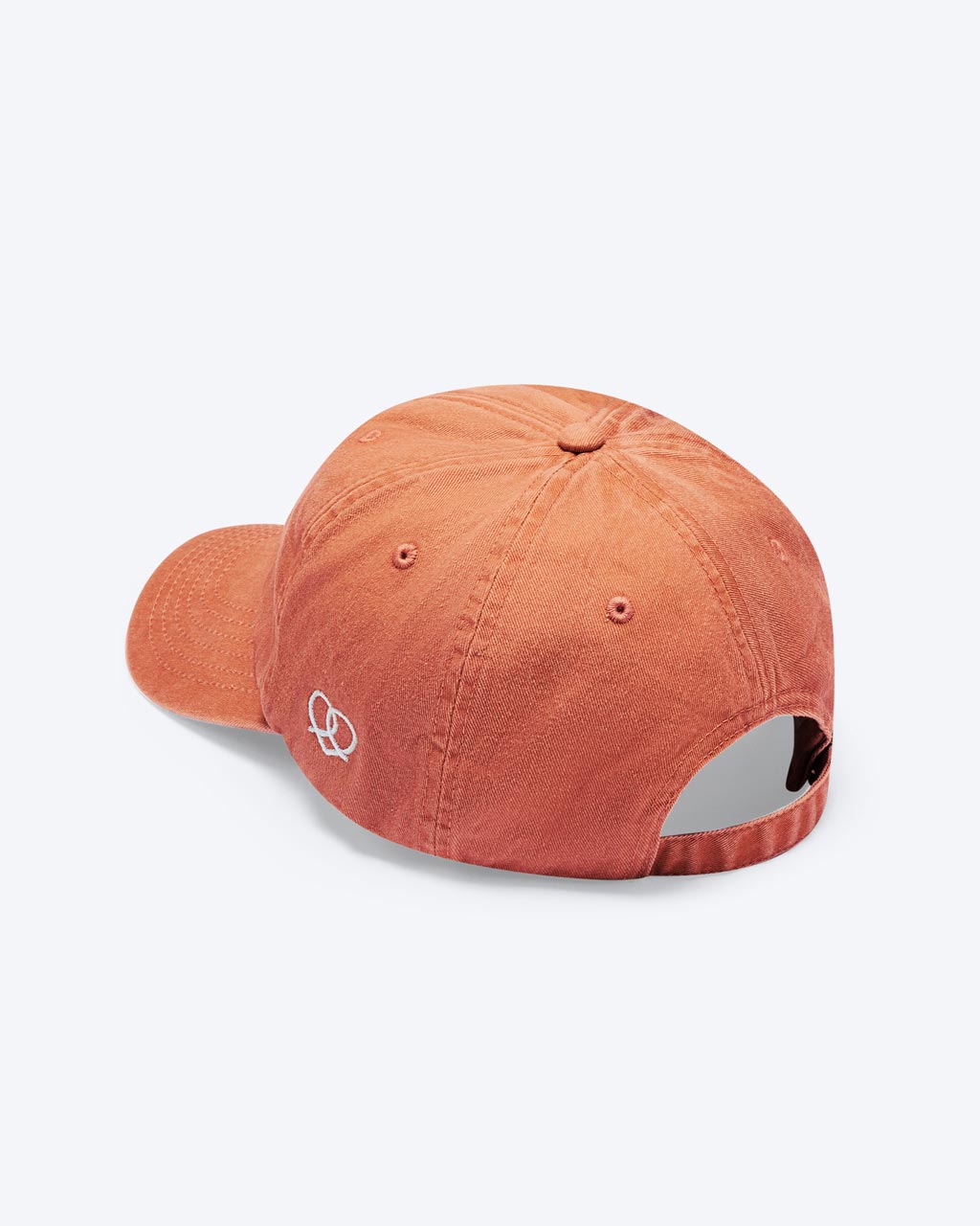 Eine Vintage orange bayerische Cap mit einem Herz-Brezn Logo an der Seite der Cap zu erkennen.