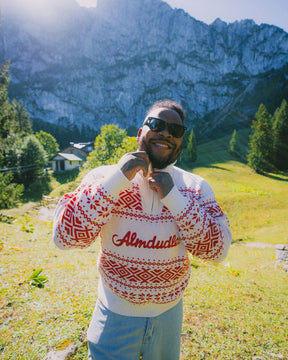 Almdudler x Strawanza Strickpullover